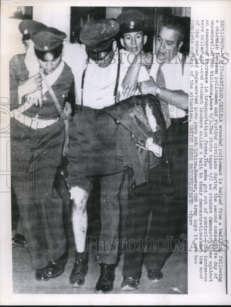 1957 Wounded Policeman Helped During a Riot by Chile Civilians - Historic Images