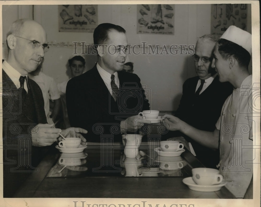 1940 Lowry Kramer serving coffee to John Coxe &amp; HG Martin - Historic Images