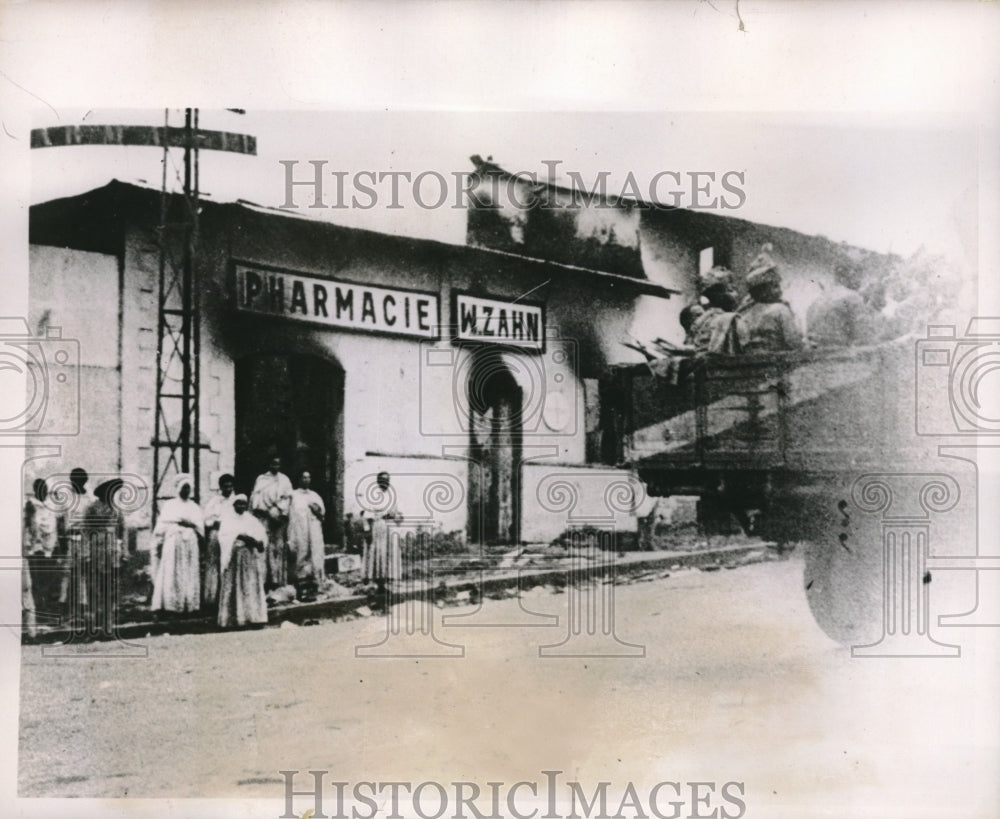 1936 Native women stand in front of charred pharmacy in Addis Ababa - Historic Images