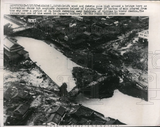 1957 drift woods & debris pile around a bridge in Kyushu, Japan - Historic Images