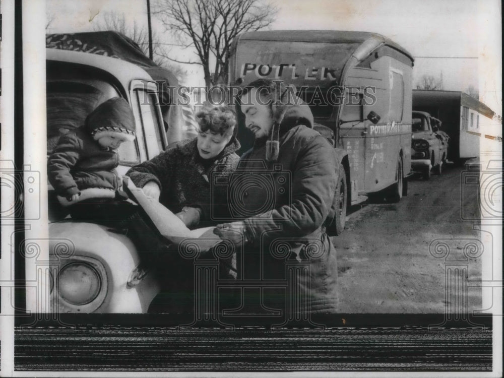 1959 Family Consulting a Map for Directions - Historic Images