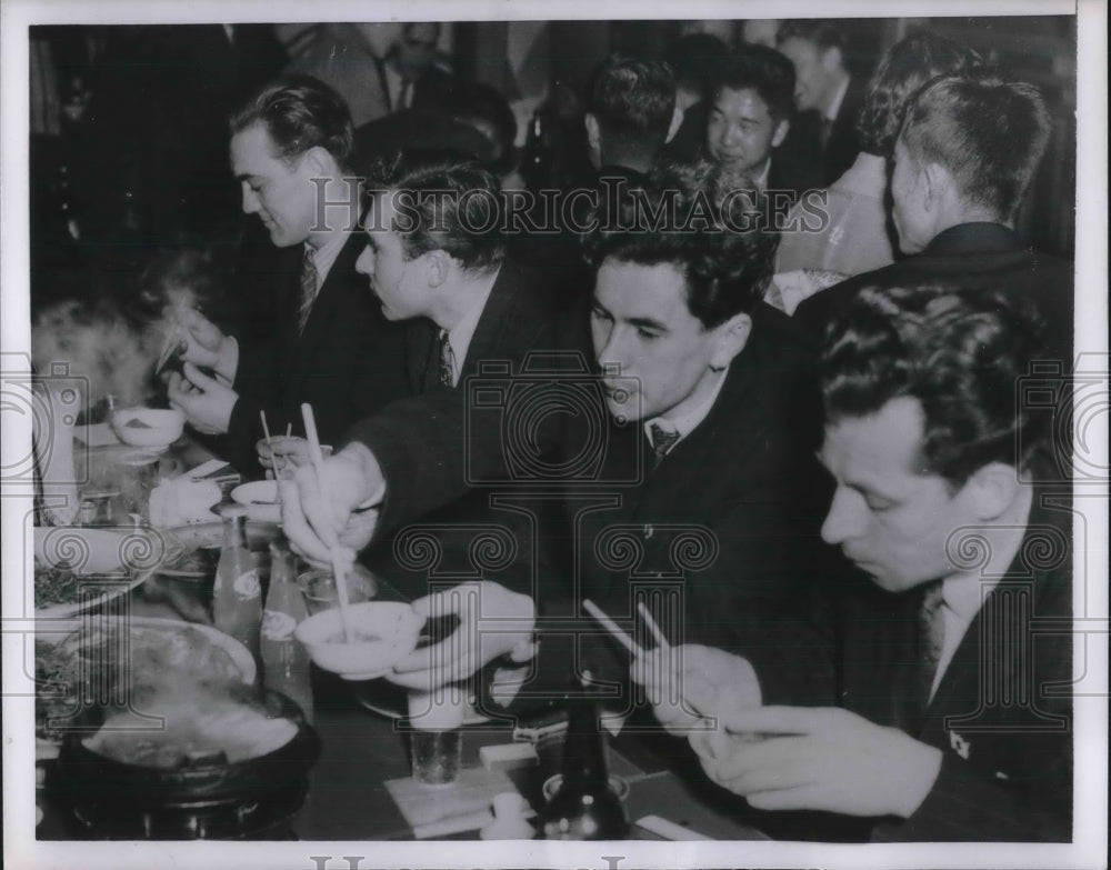 1954 Members of Russian skating team at dinner party in Toyko - Historic Images