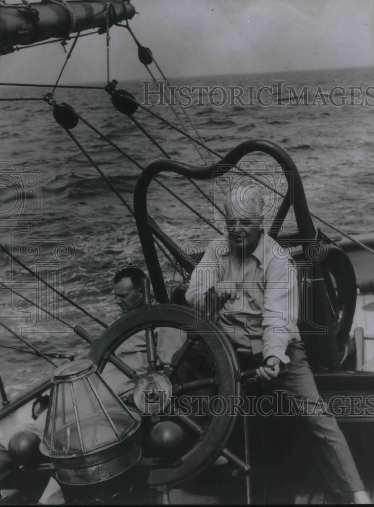 1964 Cyril Batz on his sail boat in the Bahamas - Historic Images