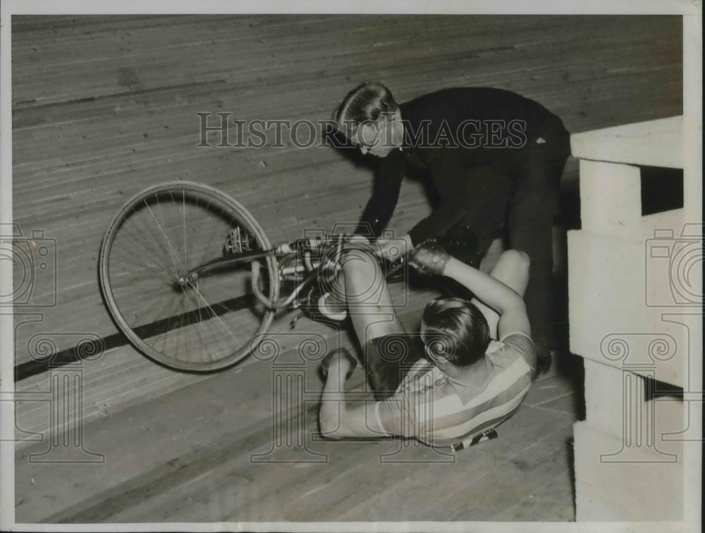 1934 Marcel Guimbretiere being helped to his feet after he fell - Historic Images