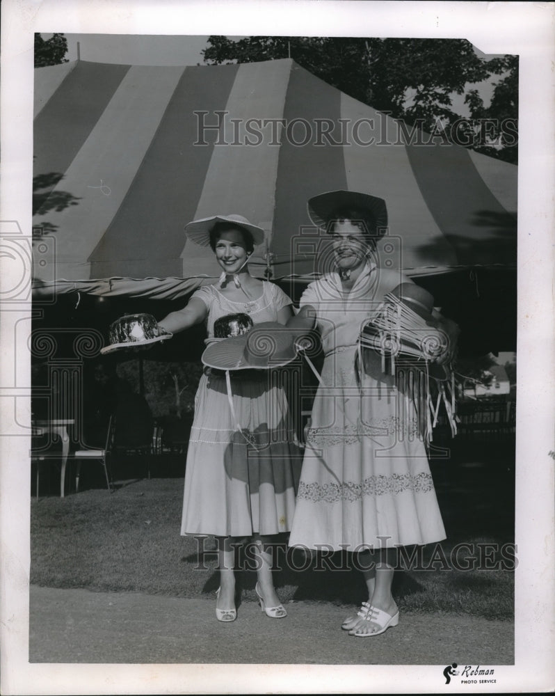 1955 Press Photo Women Distributing Hats-Historic Images