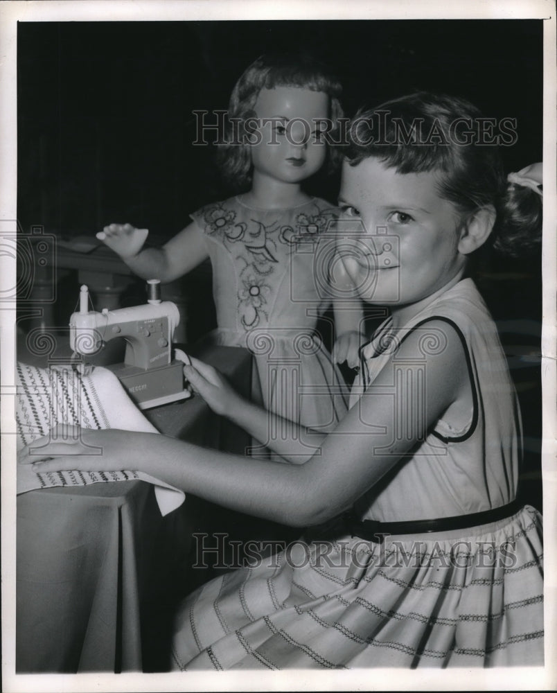 1955 NYC, Melissa Erickson with a toy Necchi sewing machine - Historic Images