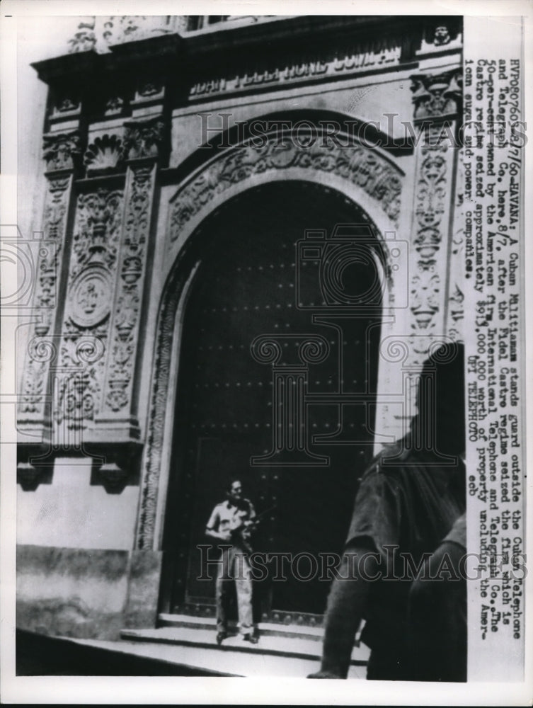 1960 Press Photo Cuban Militiaman Stands guard after Fidel Castro Sieze-Historic Images