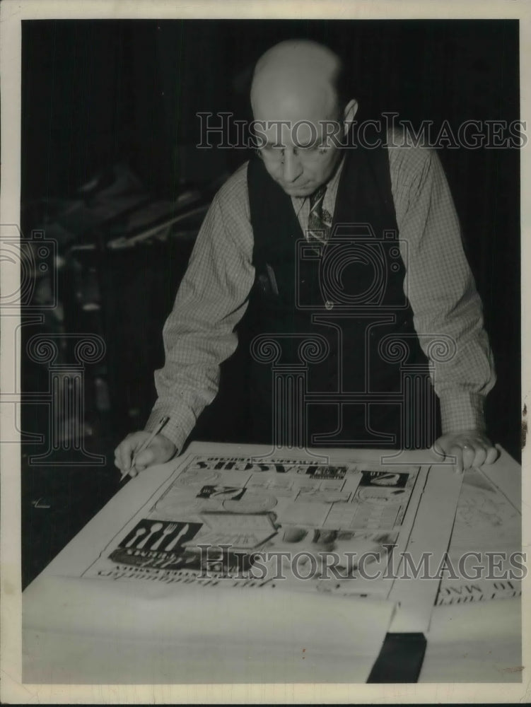 1938 Press Photo Mr Vanek checking newspaper ad layouts - nec05881 - Historic Images