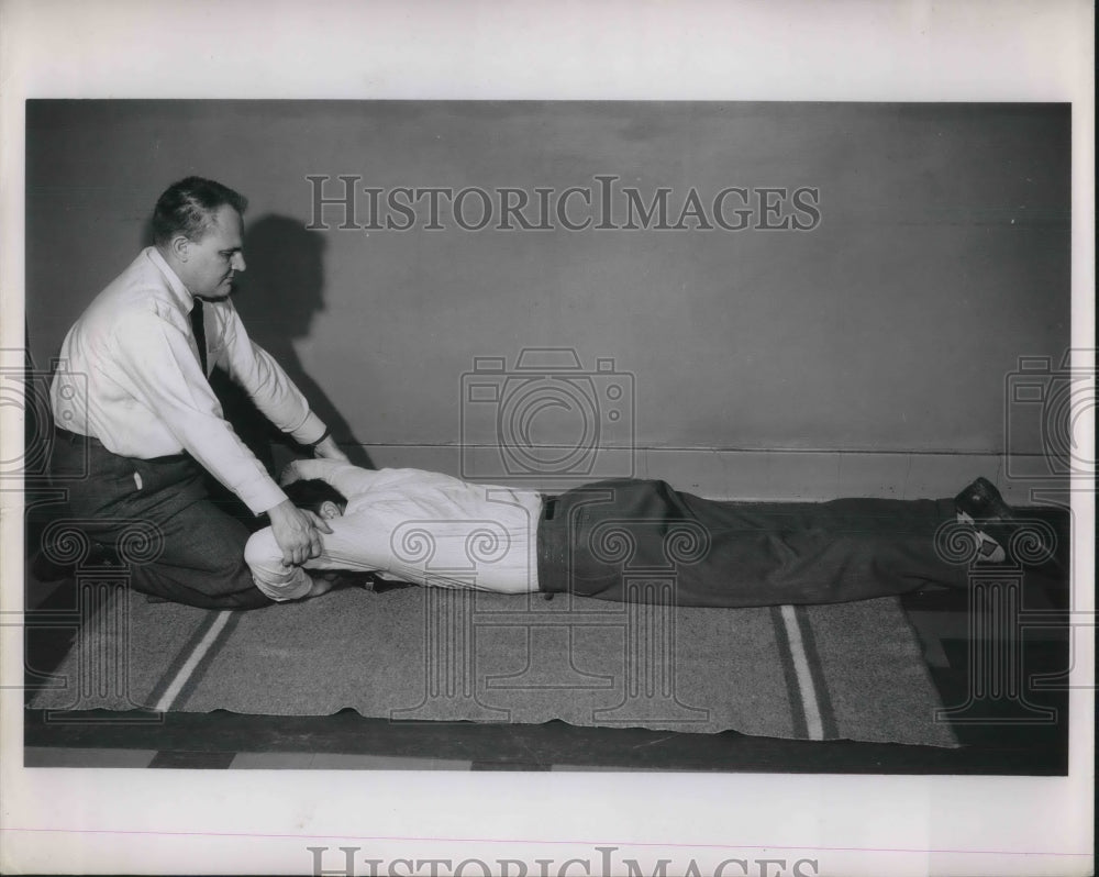 1952 Press Photo Doctor &amp; Patient Performing Artificial Respiration On Floor - Historic Images