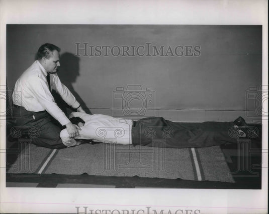 1952 Press Photo Doctor & Patient Performing Artificial Respiration On Floor - Historic Images
