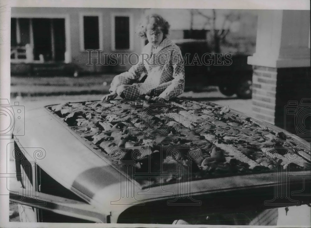 1935 Press Photo Man Looks At Roof Of Car Damaged By Hail - Historic Images