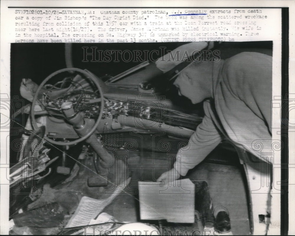 1957 Policeman Connolly Pulls Book The Day Christ Died From Wreckage - Historic Images