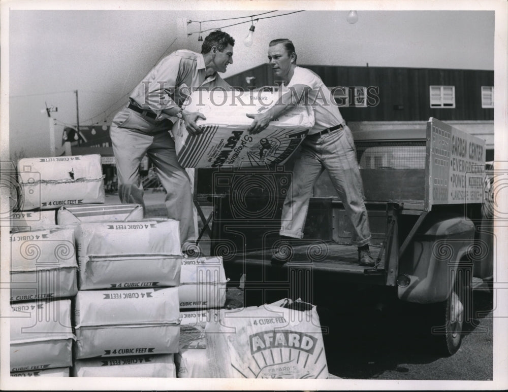 1959 George Otteviano and Frank Mickey Unloading a Truck - Historic Images