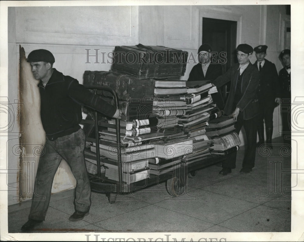 1935 Press Photo Evidence Transported by Workers to Court Room on Melba Tax Case - Historic Images