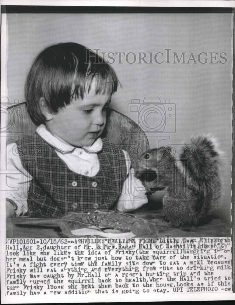 1962 Dawn Hall plays with new pet squirrel in Nashville - Historic Images