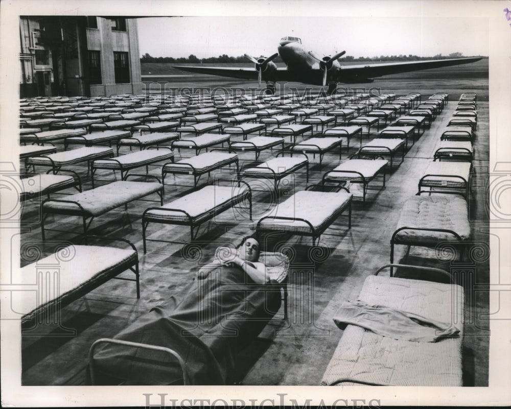 1948 Staff Sgt. Charles E. Ambrosetti Tests Cots at Brainard Fiedl - Historic Images