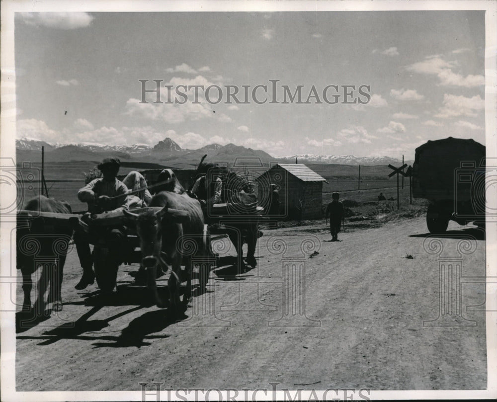 1947 Ox Drawn carts pass a truck on the road to Turkish frontier - Historic Images