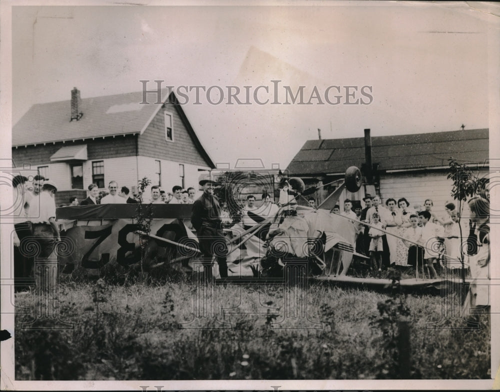 1936 Residents of Johnstown, NY surrounding wreckage of plane - Historic Images