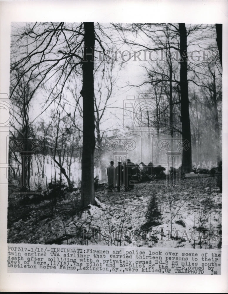 1955 Firemen and police scan the wrecked twin engined TWA Airliner - Historic Images