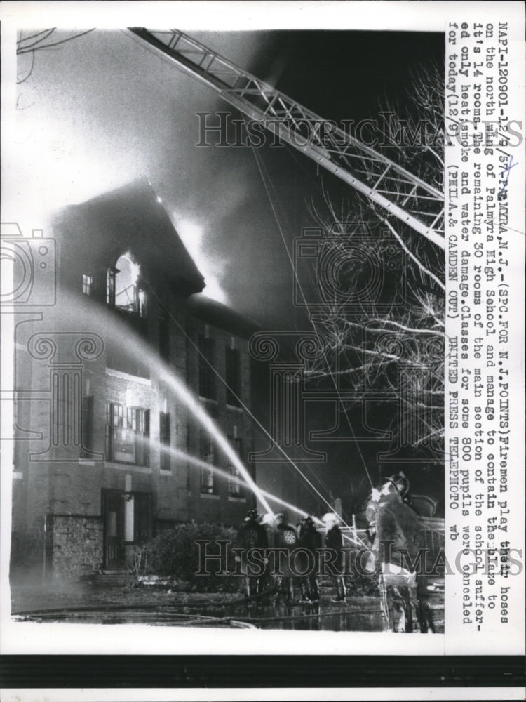 1957 Fireman controls fire on Palmyra Hugh School - Historic Images