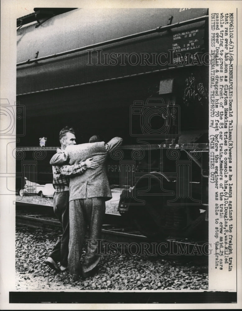 1958 Press Photo Donald Tallman weeps &amp; leans against train that ran over son - Historic Images