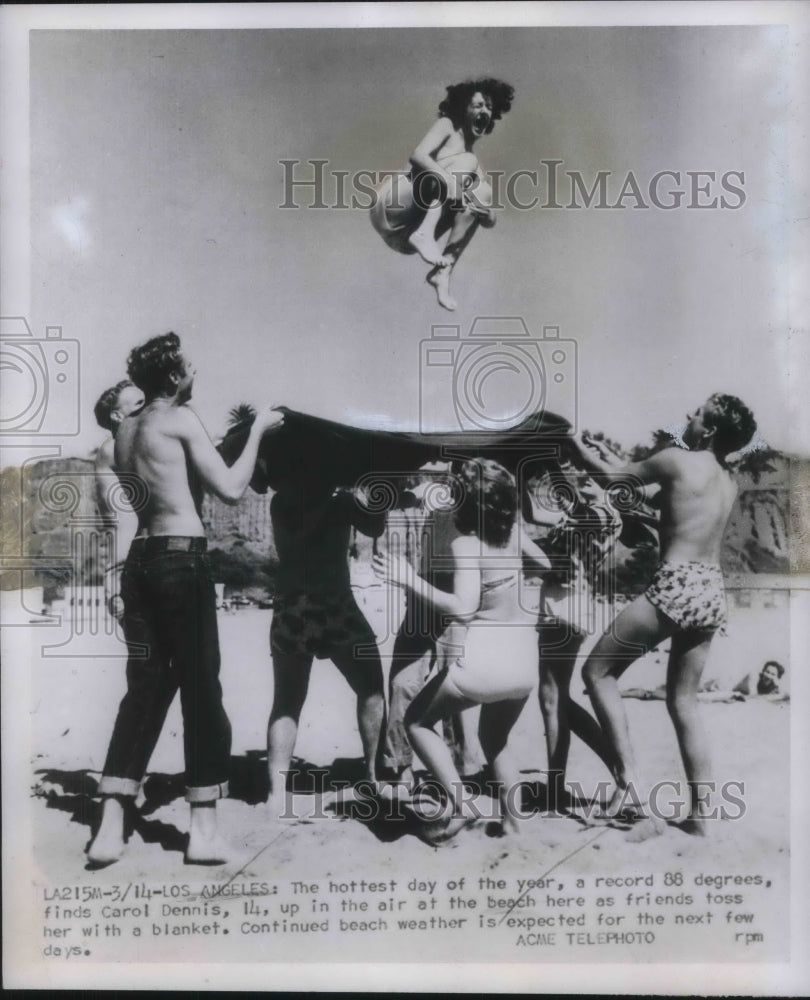 1951 Press Photo Carol Dennis Tossed in the Air Enjoying the Beach Near LA - Historic Images