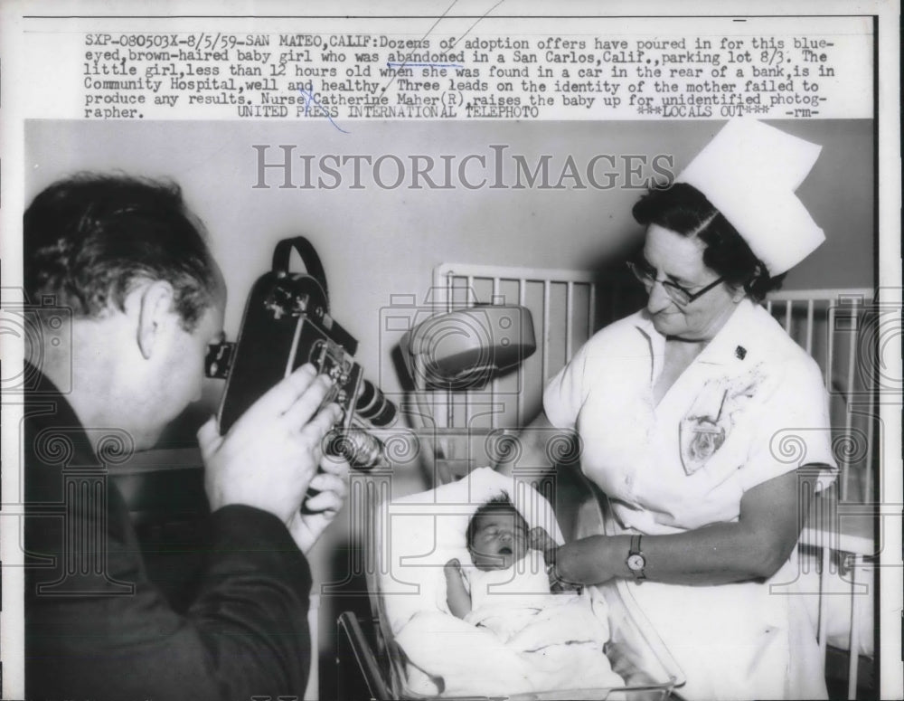 1959 Press Photo Abandoned infant less than 12 hrs old found in parking lot - Historic Images