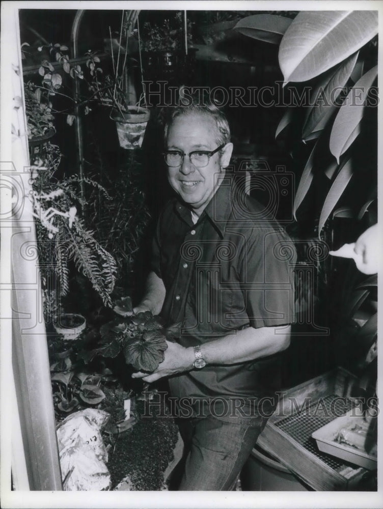 1930 A Man Surrounded by Plants - Historic Images