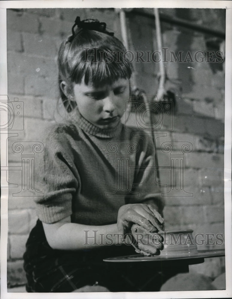 1956 Gundula Kampmann making pottery in fathers studio in Berlin - Historic Images