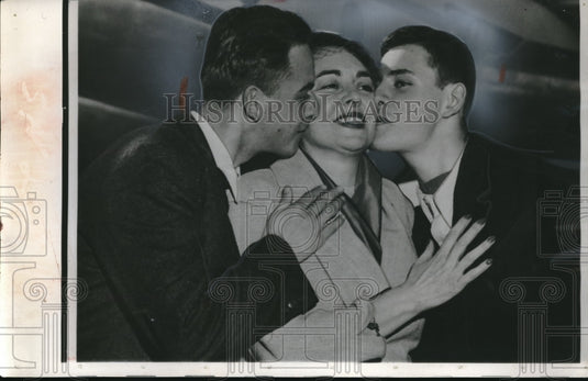 1954 Press Photo Peter Georgescu Kisses Mom After Dad's Red Romanian Release - Historic Images