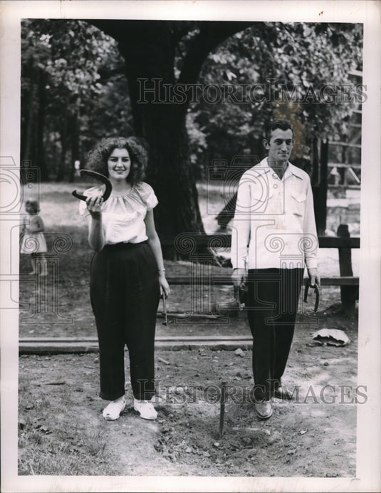 1951 Rachel Bradley & Donald Burns Play Horseshoes - Historic Images