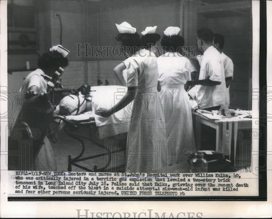 1956 Press Photo Doctors and nurses at St John Hospital working with patient - Historic Images