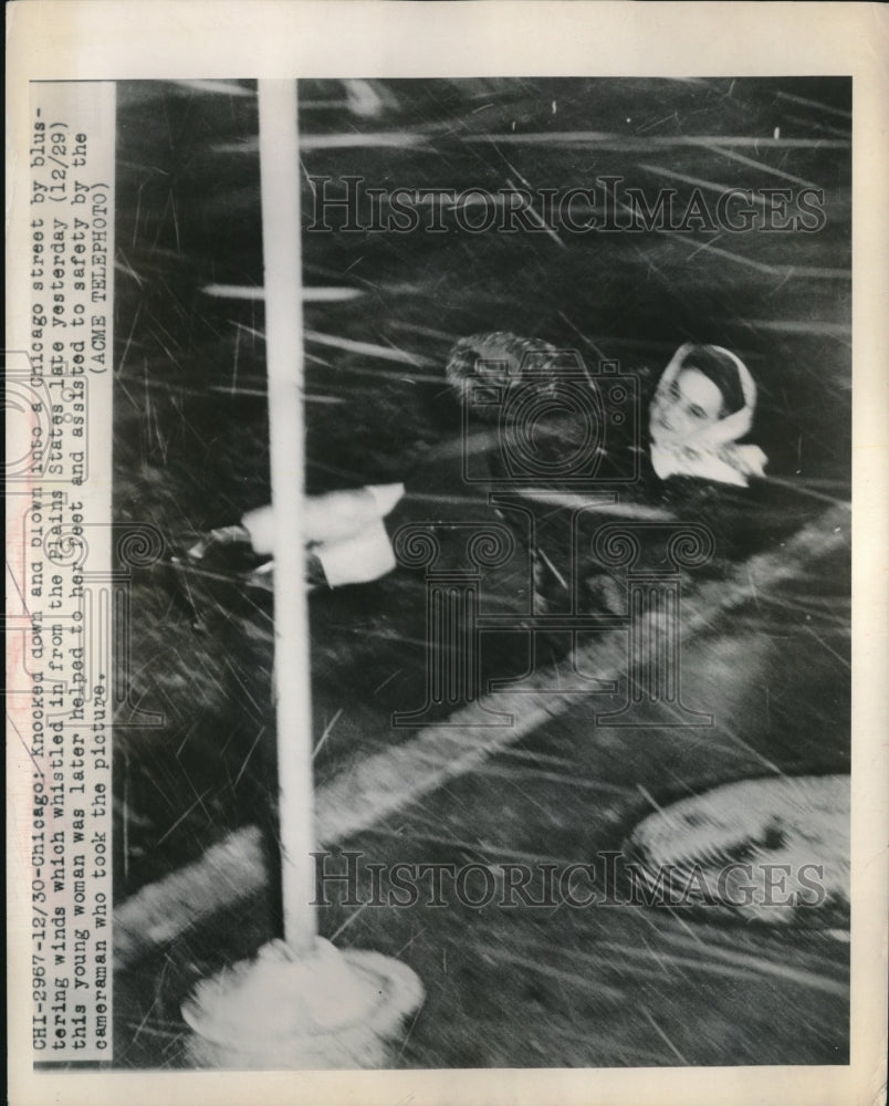 1949 Unknown woman blown by strong winds in Chicago, Illinois - Historic Images