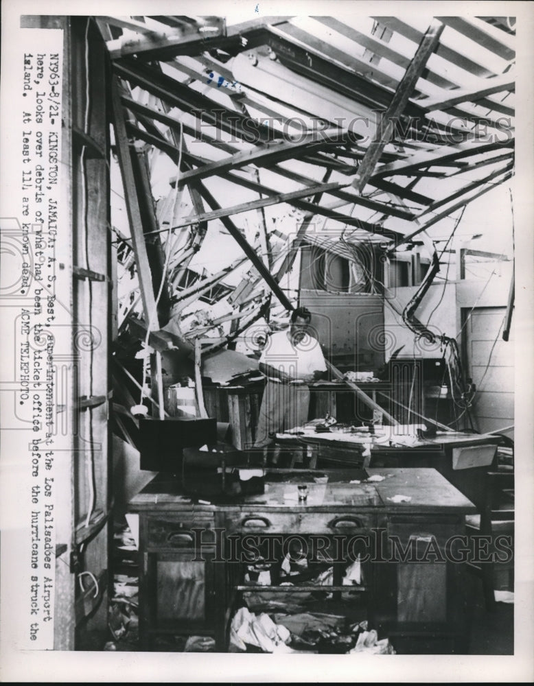 1951 Supervisor A. S. Best at the wrecked ticket office in Kingston - Historic Images