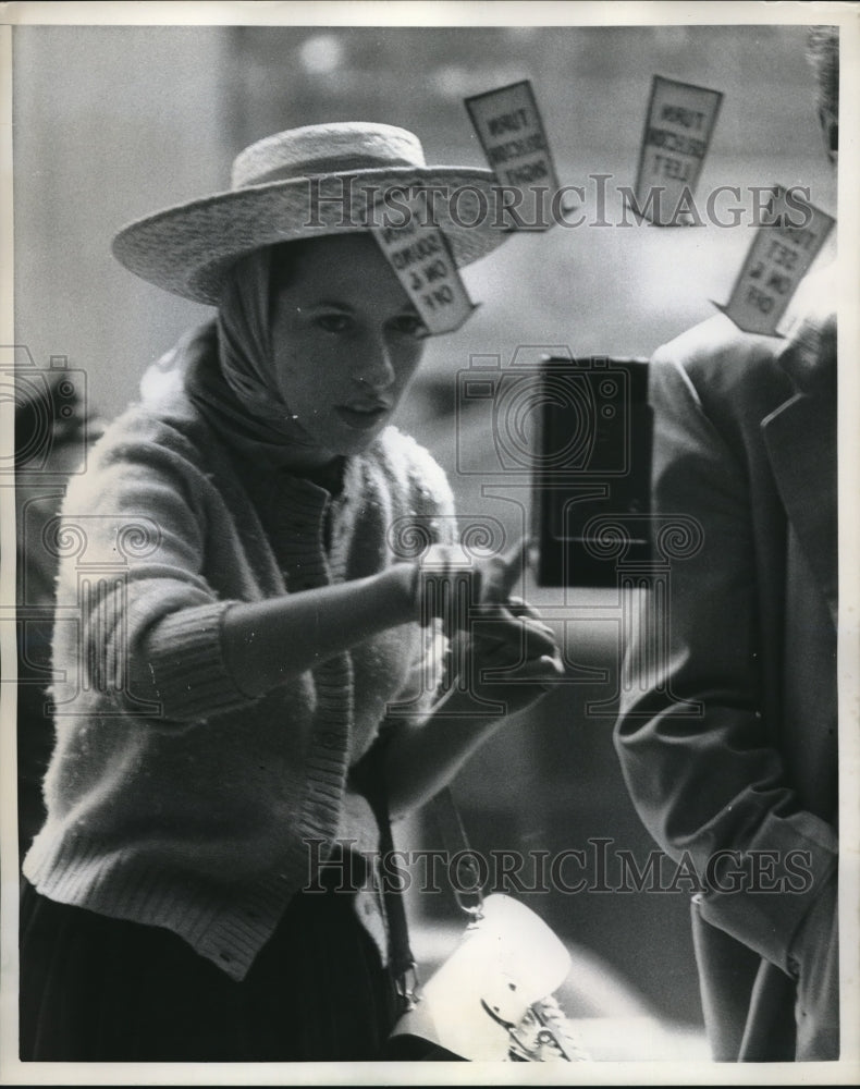 1958 Press Photo Young Lady touching the floating odd object - Historic Images