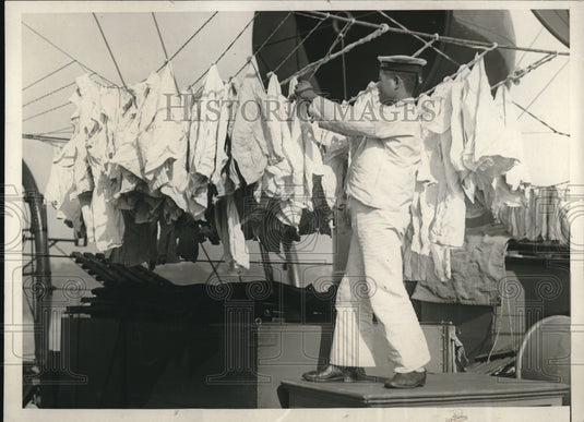 1929 Press Photo Japanese Sailor Hanging Wash on Cruiser Asama - Historic Images