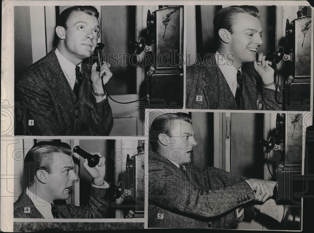 1962 man humorously demonstrating use of old fashioned telephone - Historic Images