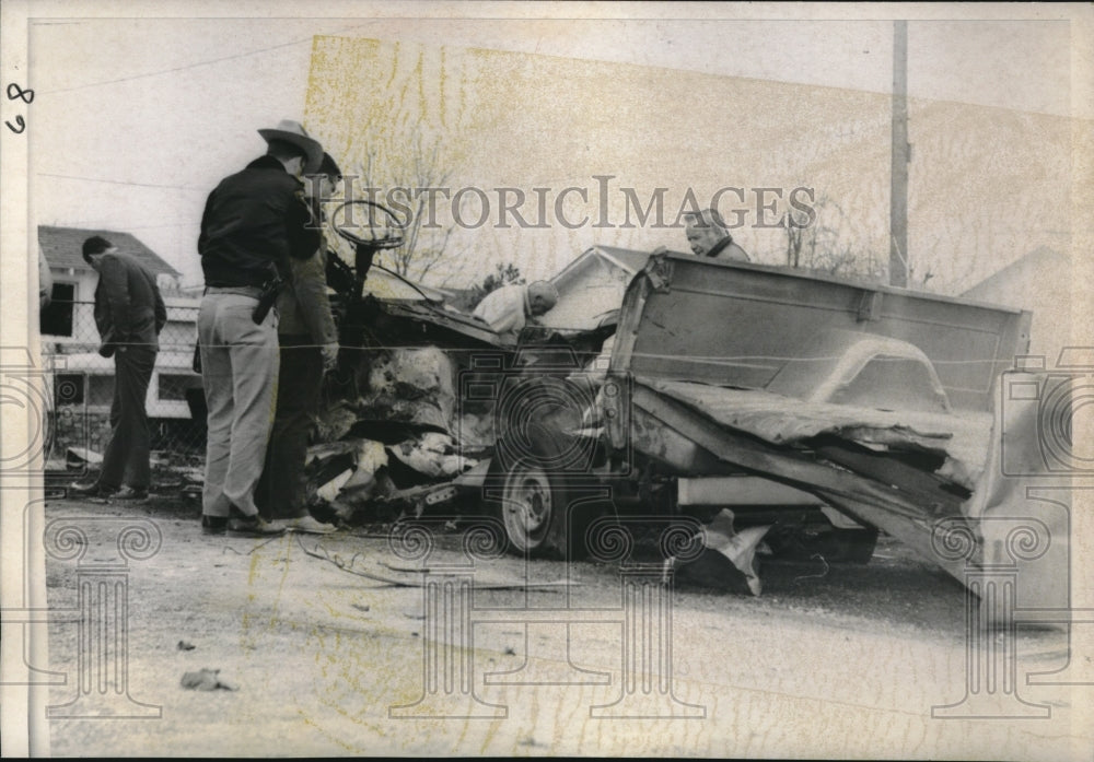 1971 Authorities inspect bombed pickup trick in Briston, Oklahoma - Historic Images