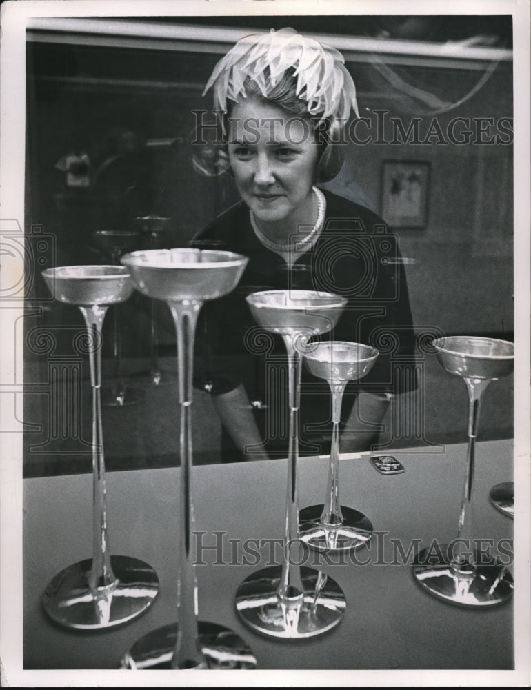 1963 Press Photo Mrs. David L. Grund In Feather Hat Inspects Silver Chalices - Historic Images