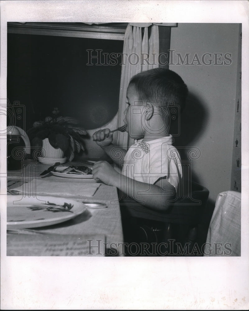 1959 Press Photo Kid eats pancakes at school fundraiser-Historic Images