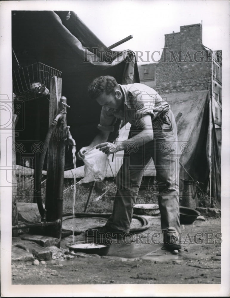 1948 Paris Tent City Resident Julian Finegold Does His Laundry - Historic Images