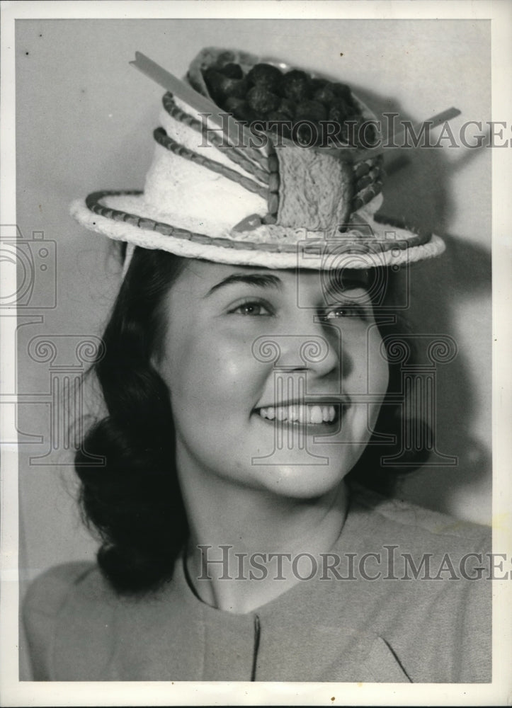 1941 Rosemary Strauss modeling a Strawberry Blonde Bonnet - Historic Images