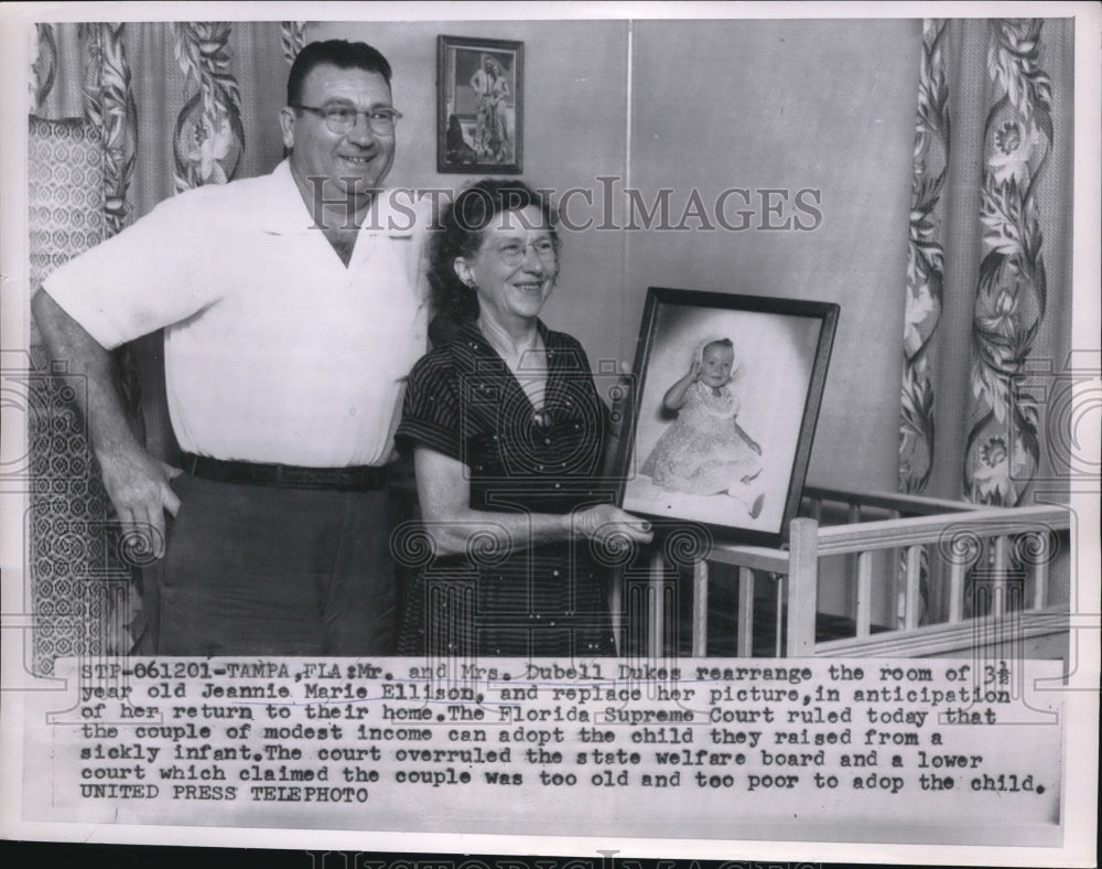 1957 Mr. and Mrs Dubell Dukes rearragnge room of Jeannie Ellison - Historic Images