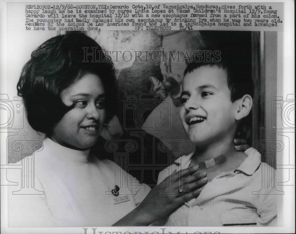 1968 Cerardo Coto examined by nurse Lydia Lopez, Texas Children Hosp - Historic Images