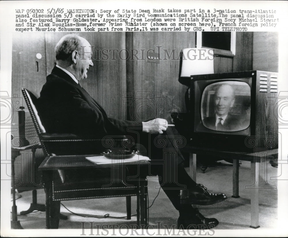 1965 Secretary Of State Dean Rusk Watches TV Show And Smokes Cig - Historic Images