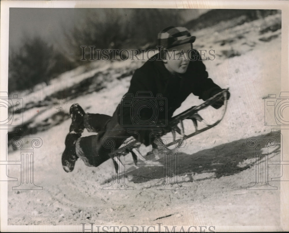 1950 Press Photo Boy Anthony Goralski Flies Down Snowy Hill On Sled-Historic Images