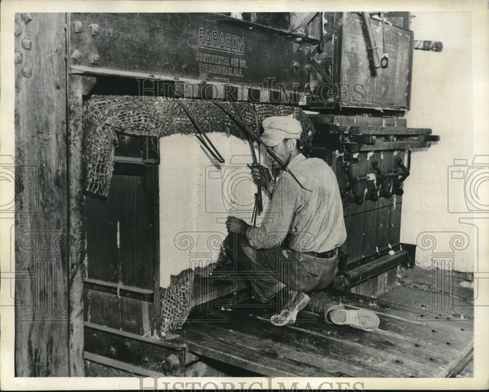 1936 Fastening of long Metal Bands Around Bale of Cotton in Press - Historic Images