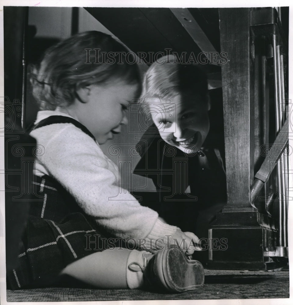 1952 Press Photo Mother and Daughter Playing Beneath Piano - nec27037 - Historic Images