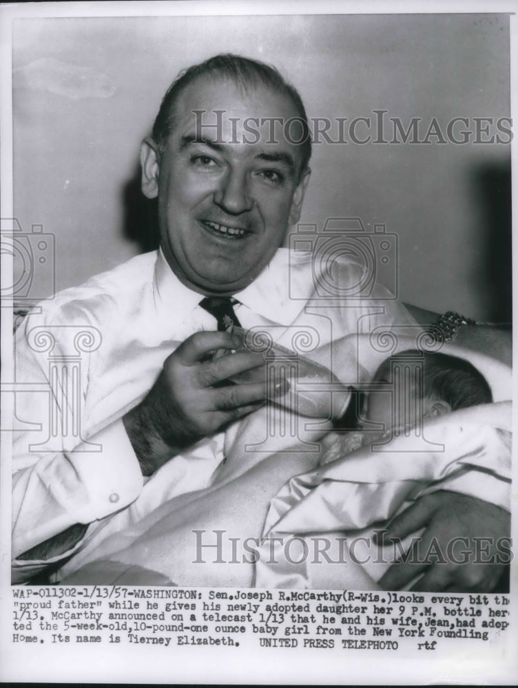 1957 Press Photo Sen Joseph McCarthy feeding newly adopted daughter - Historic Images