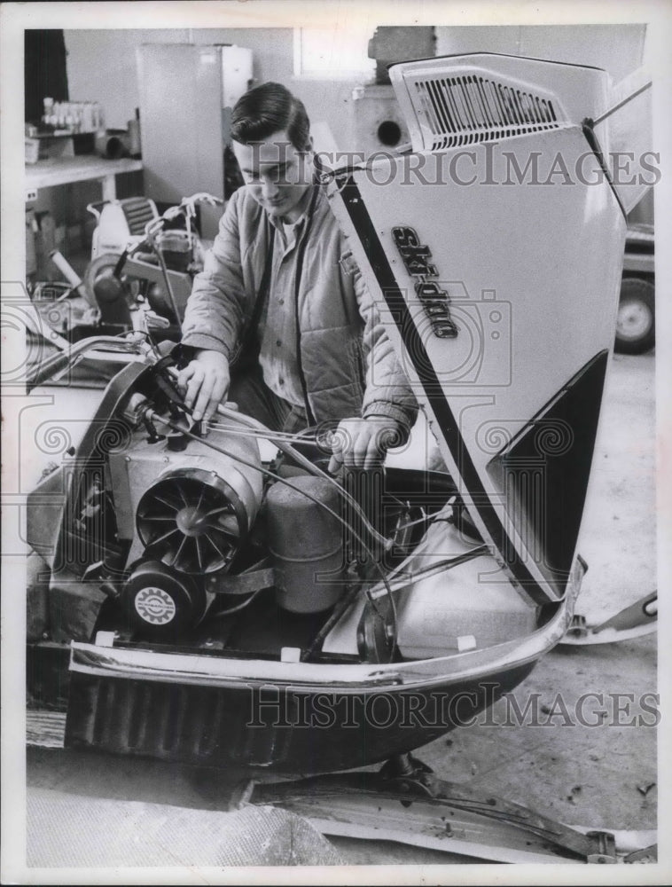 1970 Press Photo Eric Grayson Repairs Snow Mobile-Historic Images